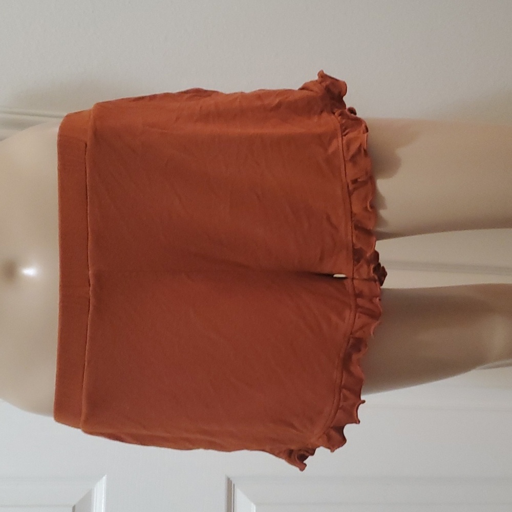 The Boutique s cute and comfy ruffle bottom slip on shorts burnt orange pockets